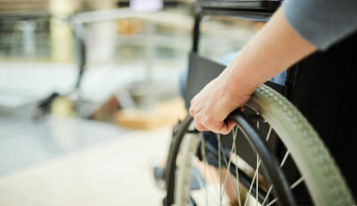 Close-up of a wheelchair, highlighting Federal Disability Benefits.