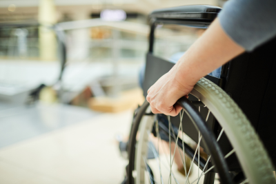 Close-up of a wheelchair, highlighting Federal Disability Benefits.