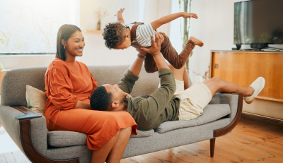 Happy family at home, highlighting the importance of understanding federal disability benefits.