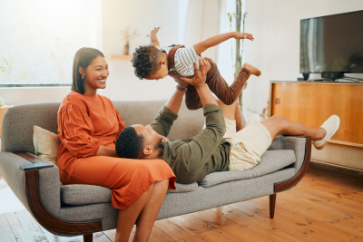 Happy family at home, highlighting the importance of understanding federal disability benefits.