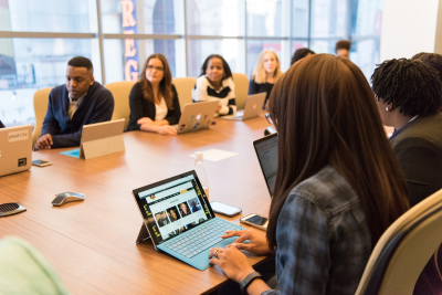 Federal employees in a meeting discussing disability insurance.