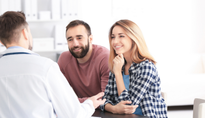 Couple consulting an expert on the best FEHB plans.