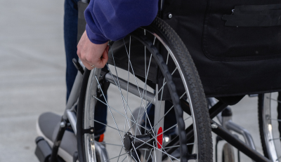 Person using a wheelchair, focusing on working while on federal disability