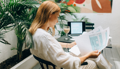 Woman reviewing documents, exploring FEGLI coverage options.