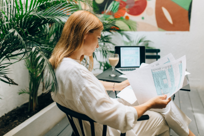 Woman reviewing documents, exploring FEGLI coverage options.