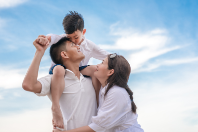 Happy family enjoying time together outdoors, symbolizing financial security with short-term disability term coverage.
